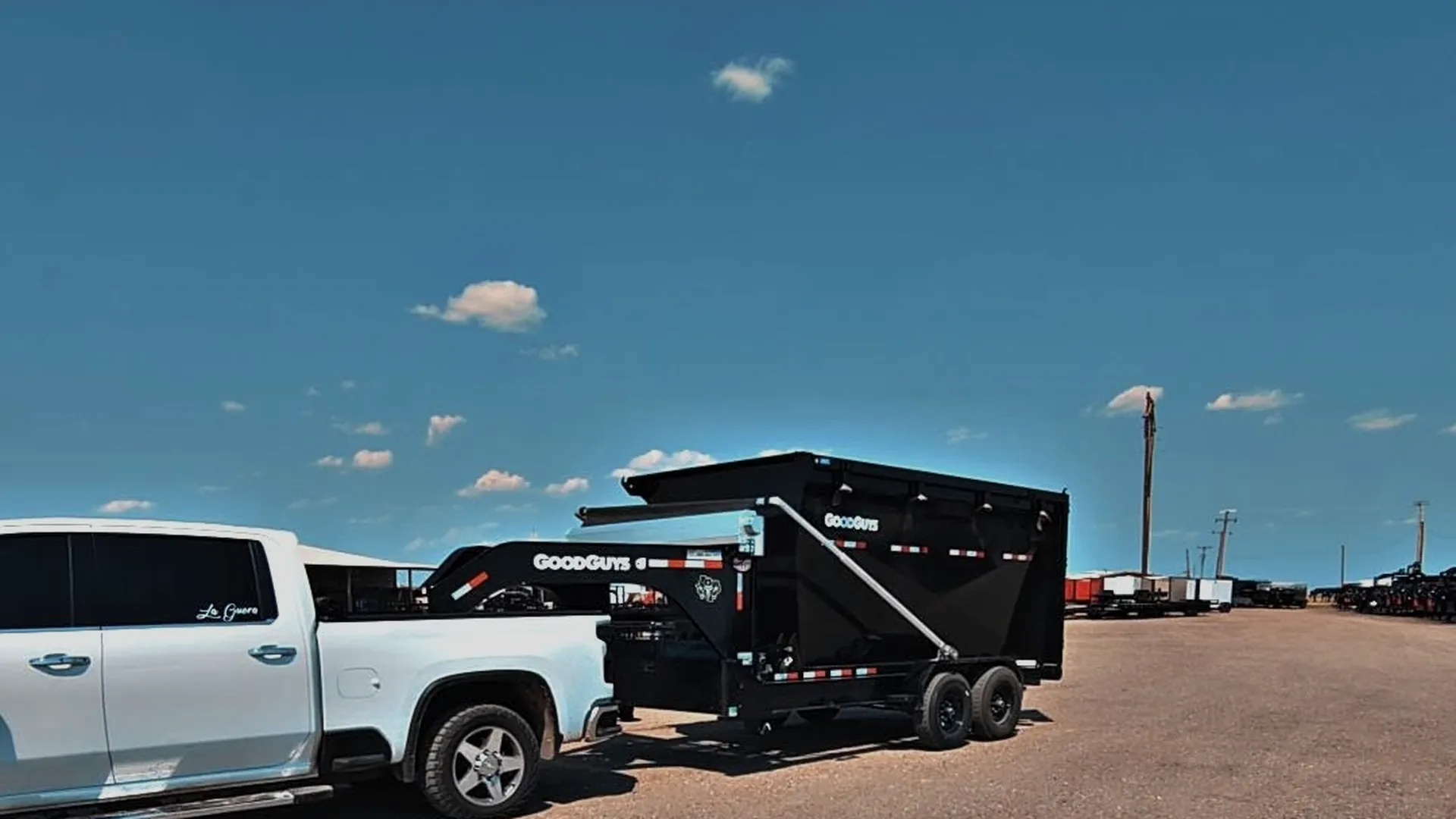 Outlaw Haulin truck and dump trailer under a Texas Panhandle sky in Amarillo